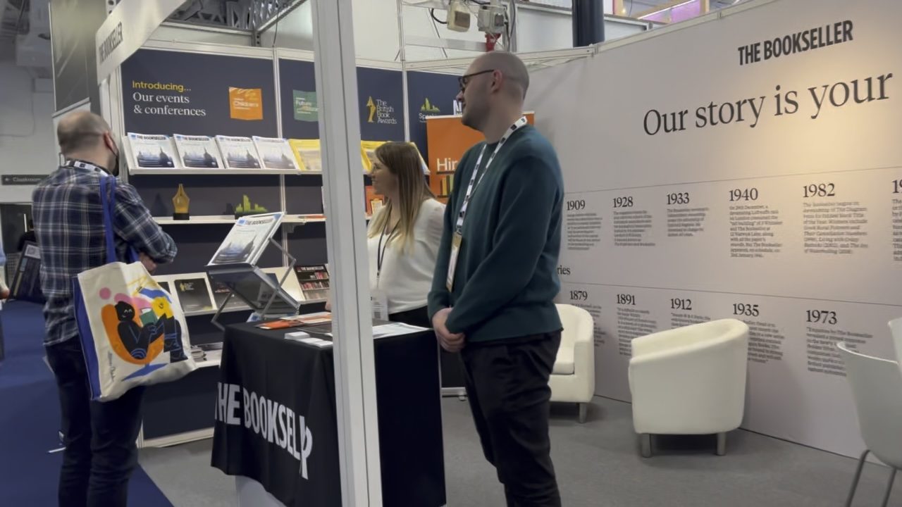 The Bookseller stand at the London Book Fair, with a timeline of the magazine on the wall
