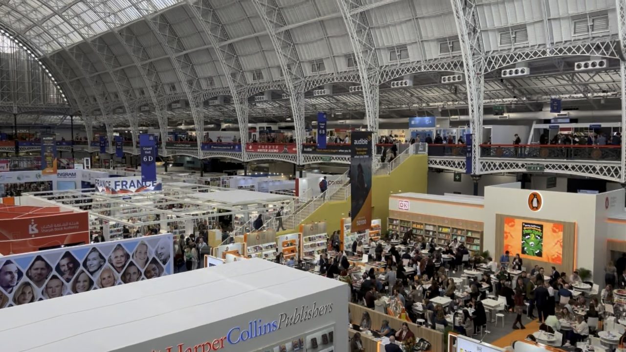 A high view of the London Book Fair floor, with HarperCollins in the foreground and Penguin Random House to the right